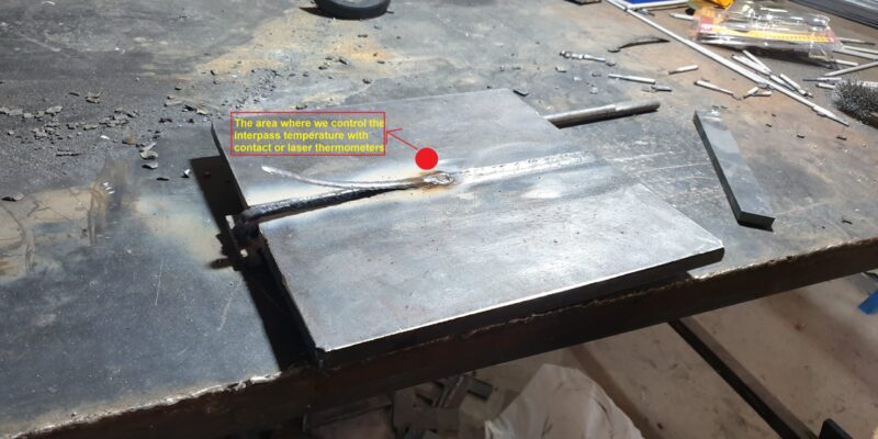 During welding, it is necessary to keep the temperature of the part between 100 and 150 degrees, and the location of measuring this temperature is shown with a red spot. Therefore, it is necessary to pay attention to the welding time of the passes so that the temperature of the part stays within this range.